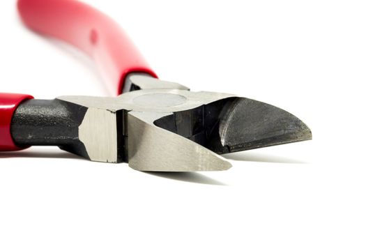 Red open and handled pliers  on a white background.Tools series.