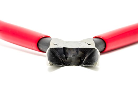 Red open and handled pliers  on a white background.Tools series.