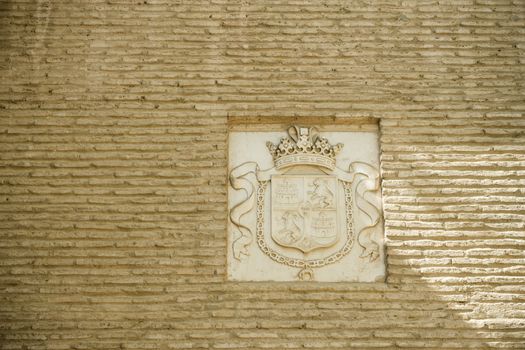 Design pattern insignia on a wall in Seville, Spain, Europe