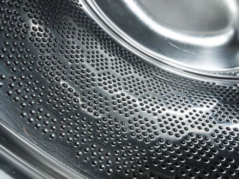 close up of metal inside a washing machine; England; UK
