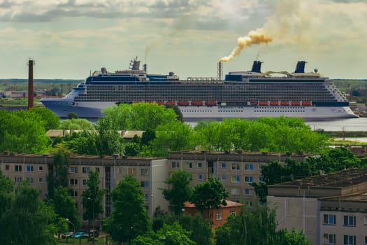 Large cruize liner. Passenger ship moored in old town