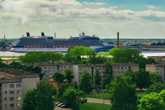 Large cruize liner. Passenger ship moored in old town