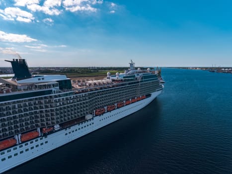 Big white passenger ship moored at the cargo port