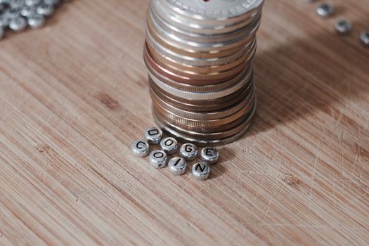 Digital currency doge coin inscription on the wooden board. Separate silver letters.