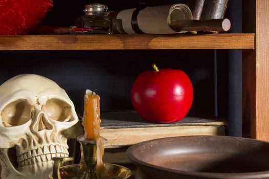 Gothic still life with a skull and an apple
