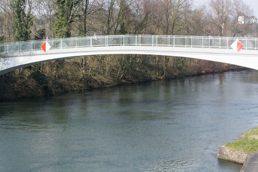 Pedestrian bridge steel arch structure over the river Ruhr in Muelheim, Germany.