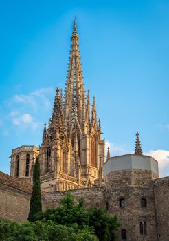 Barcelona, Spain - September 25, 2015: Spire of Cathedral of the Holy Cross and Saint Eulalia in Barcelona, Spain at sunset. Copy space in blue sky.