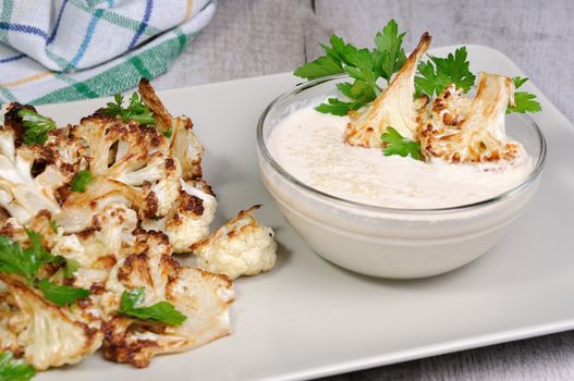 Roasted cauliflower with tahini sauce (sesame paste)