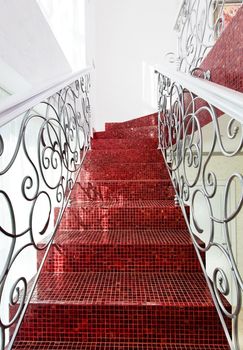 Classical mosaic stairs with beautiful handrail close up