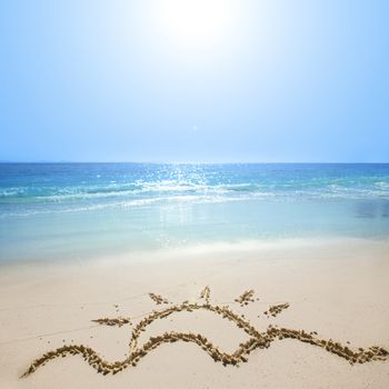 Drawing of waves and hot summer sun on golden beach sand conceptual of a summer vacation on a tropical beach