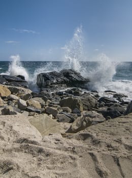 Waves crashing over rocks at Thornhill Broom beach in California