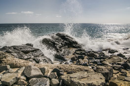 Waves crashing over rocks at Thornhill Broom beach in California