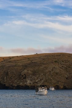 Dusk panorama at Santa Cruz Island as seen from a boat. Santa Cruz, Channel Islands, California