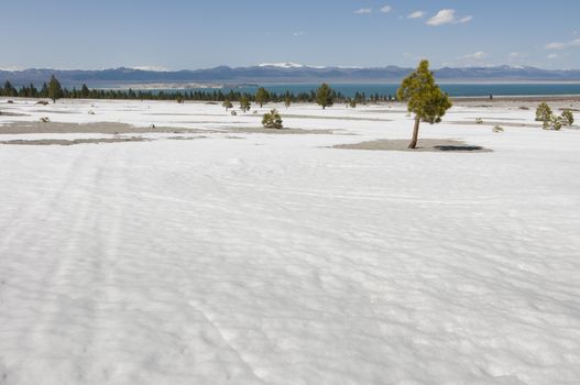 barren land with Mono Lake in distance, California