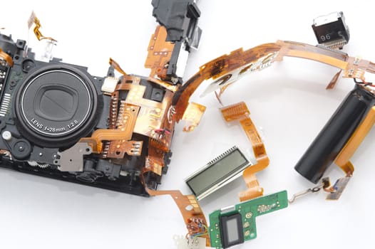 Electronic parts of disassembled compact camera in close-up