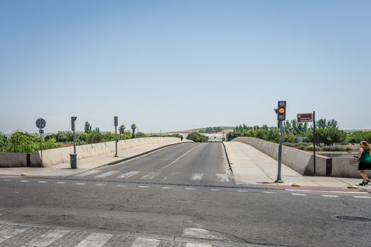 Entrance to Puente De Miraflores, a modern steel bridge on the Guadalquivir river a short distance upstream from the Roman bridge. The bridge was inaugurated in 2003 and is constructed of a steel beam resting on a single support in the river.