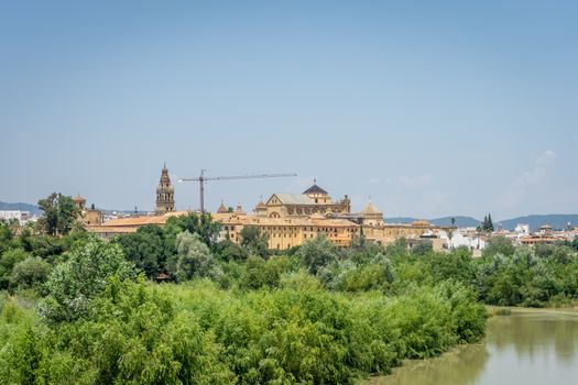 The bell tower and Mezquita de Córdoba,the Great Mosque of Córdoba, Mosque-Cathedral,Mezquita from the bridge on river Guadalquivir