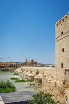 A view of the Calahorra tower, roman bridge and the Mezquita de Córdoba,the Great Mosque of Córdoba, Mosque-Cathedral,Mezquita and bell tower from the bridge on river Guadalquivir