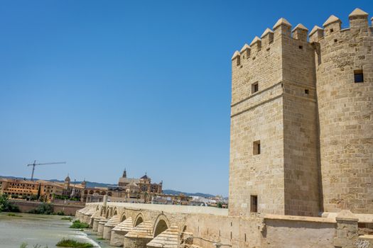 A view of the Calahorra tower, roman bridge and the Mezquita de Córdoba,the Great Mosque of Córdoba, Mosque-Cathedral,Mezquita and bell tower from the bridge on river Guadalquivir