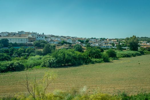 White houses in the spanish countryside of Cordoba, Spain, Europe on a bright sunny day with blue sky