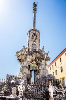 Photo of the Arcangel San Rafael, the patron of Cordoba in front of the Mosque Church, La Mezquita,Mezquita de Córdoba,the Great Mosque of Córdoba, Mosque-Cathedral,La Mezquita, Mezquita in Cordoba, Andalucia on a bright summer say with blue sky