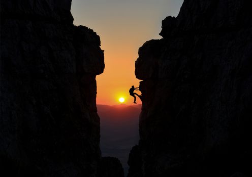 Climber between two large rocks