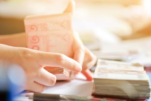 close up image of female hand count the money, business accounting background