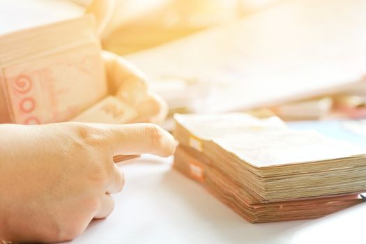 close up image of female hand count the money, business accounting background