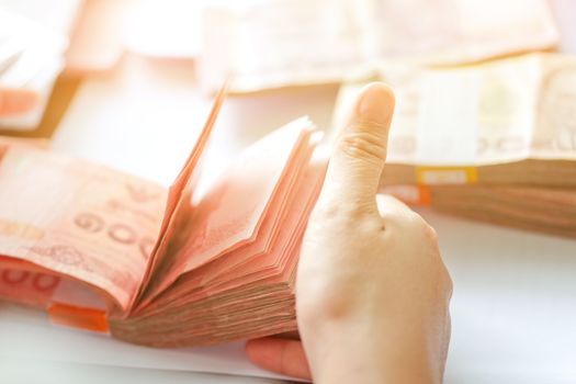 close up image of female hand count the money, business accounting background