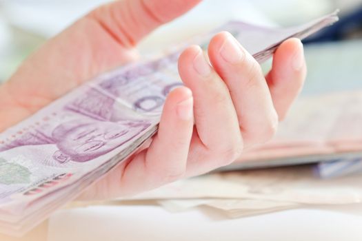 close up image of female hand count the money, business accounting background
