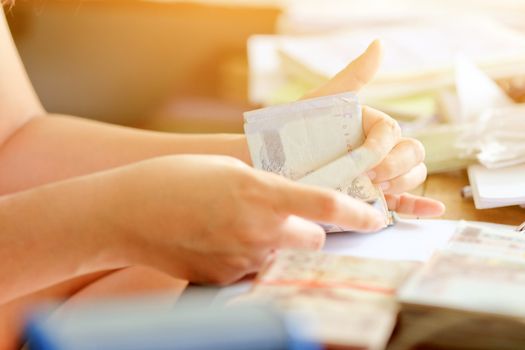 close up image of female hand count the money, business accounting background