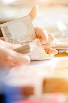 close up image of female hand count the money, business accounting background