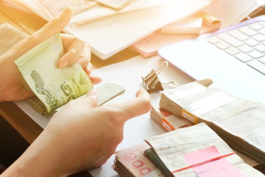 close up image of female hand count the money, business accounting background