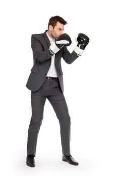 Businessman in boxing gloves isolated on white