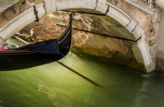 Beautiful view of the canal with a floating gondola in Venice, Italy