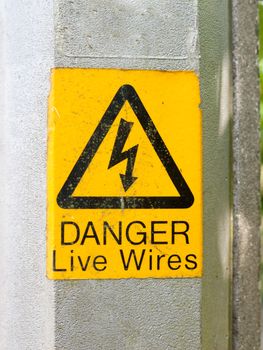 a yellow triangle with lightening bolt saying danger live wires graphic resource