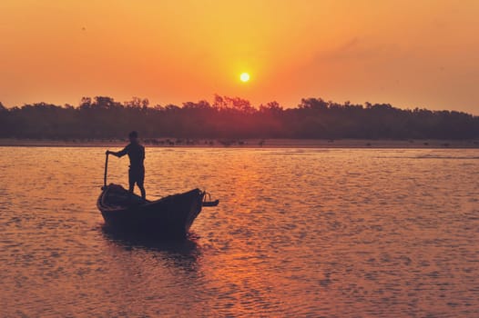 Morning light over the river and boats