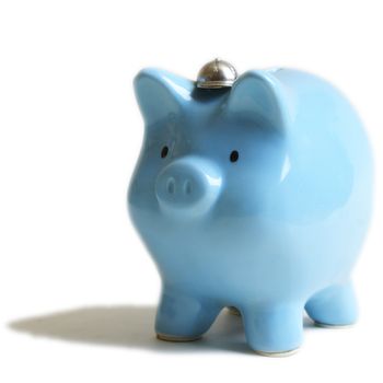 An isolated image of a baby blue piggy coin bank for use as a design element.
