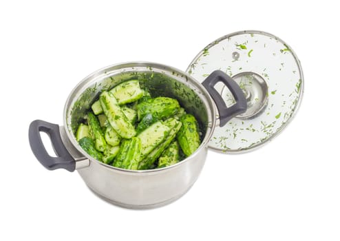 Lightly salted cucumbers in the stainless steel saucepot and glass cover beside on a white background
