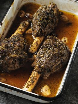 close up of rustic greek roasted lamb shank