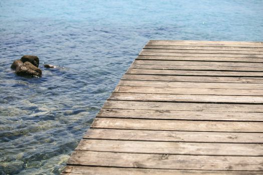 Wooden pier on the mediterranean sea