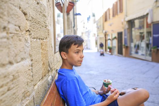 Green eyes boy with bicycle wheel