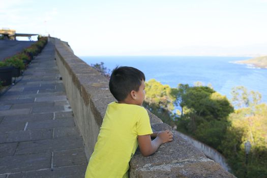 Boy seeing the blue sea