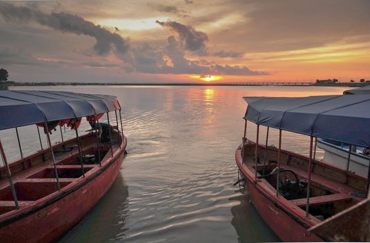 Morning light over the river and boats