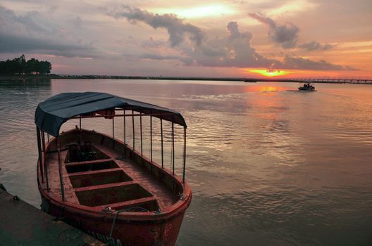 Morning light over the river and boats