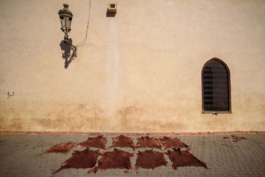 Leather drying on a street in Marrakesh, Morocco.