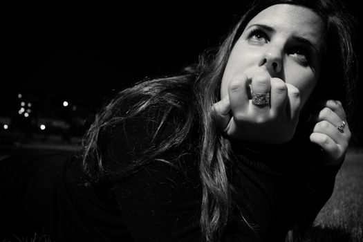 Woman in thought and looking up.