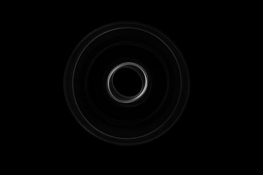 Light painted glowing abstract black and white curved lines on a black background