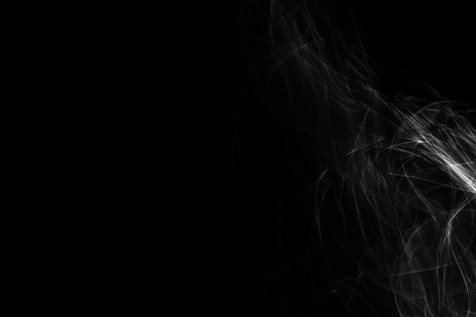 Light painted glowing abstract black and white curved lines on a black background
