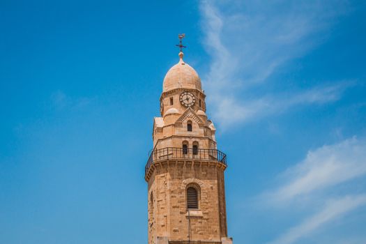 The clock tower of the Abbey of the Dormition building at mount zion in Jerusalem.